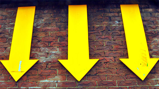 arrows going down