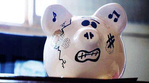 beat up broke piggy bank