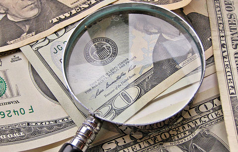 magnifying glass money