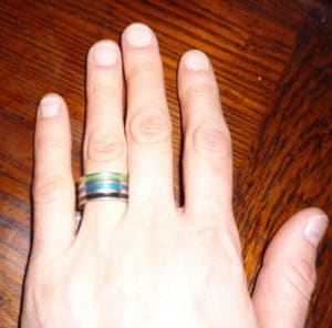 Paula's frugal engagement ring is clear plastic with three colored stripes