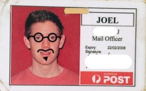 Joel's old work badge for the AU Post