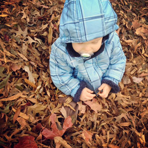 baby in leaves