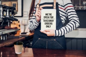 a coffee shop is open for takeout only