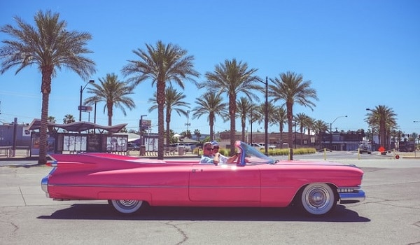 cruising away in a pink convertible