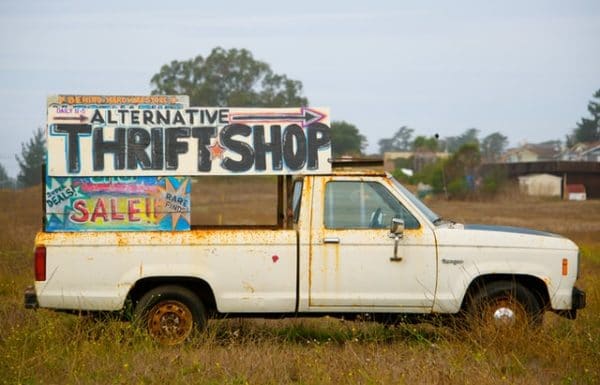 an old pickup truck has been turned into an alternative thrift shop